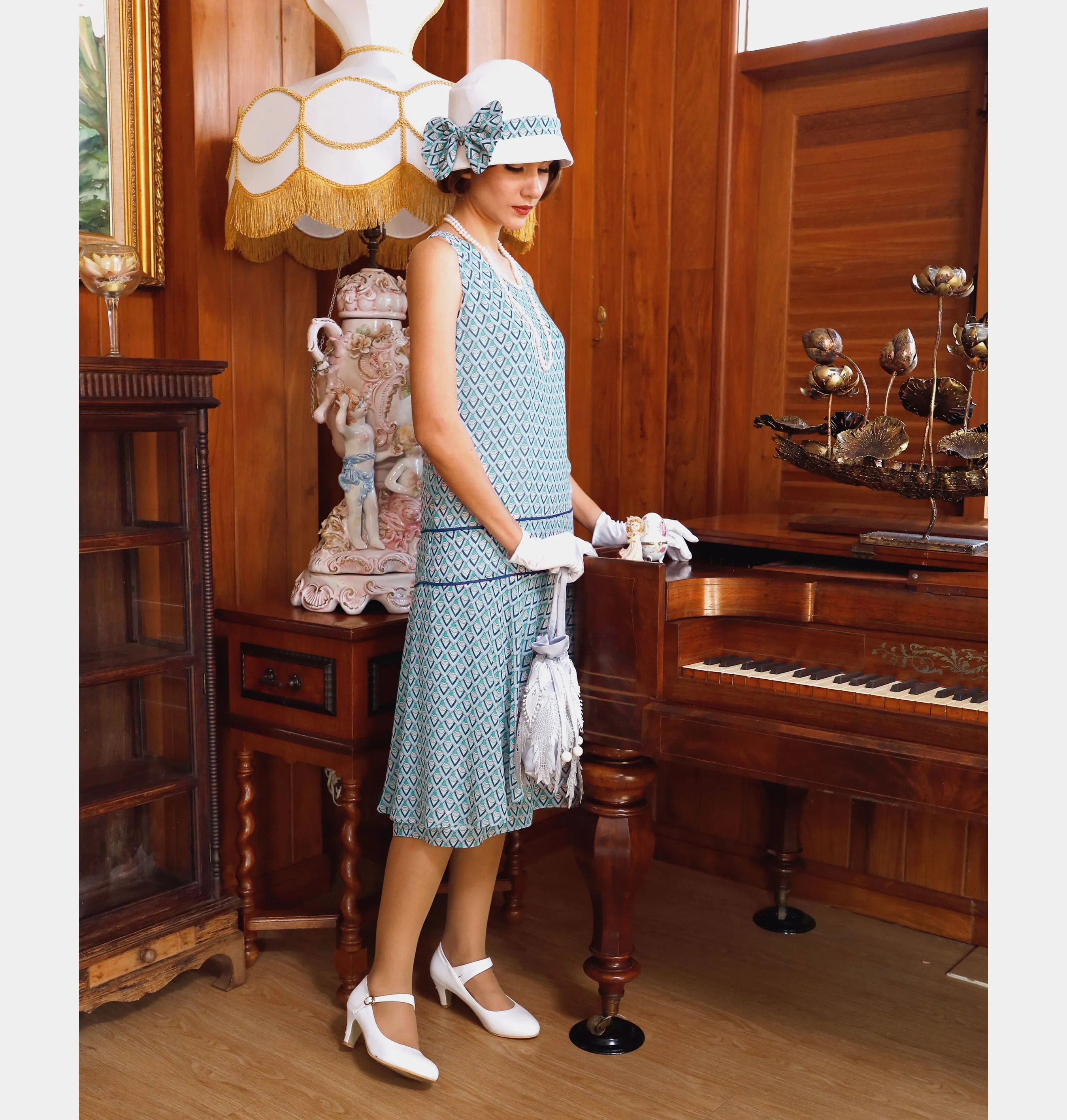 1920s summer dress of printed light blue chiffon with a ruffled skirt detail