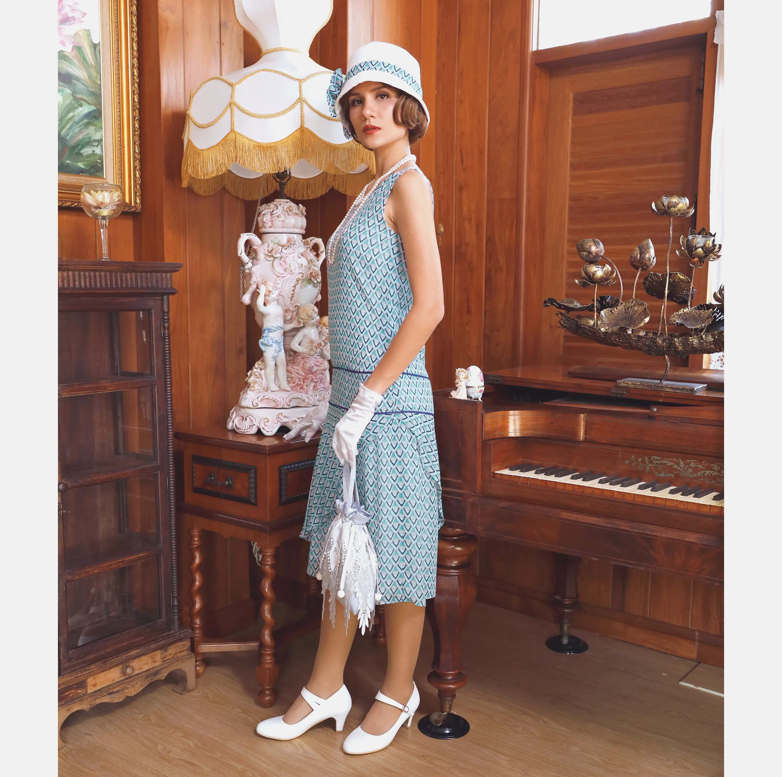 1920s summer dress of printed light blue chiffon with a ruffled skirt detail