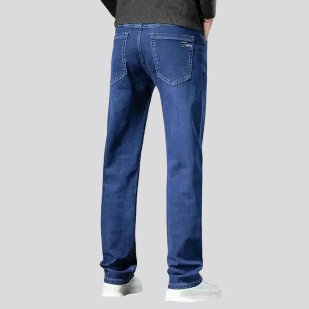 Stretchy men's mid-waist jeans